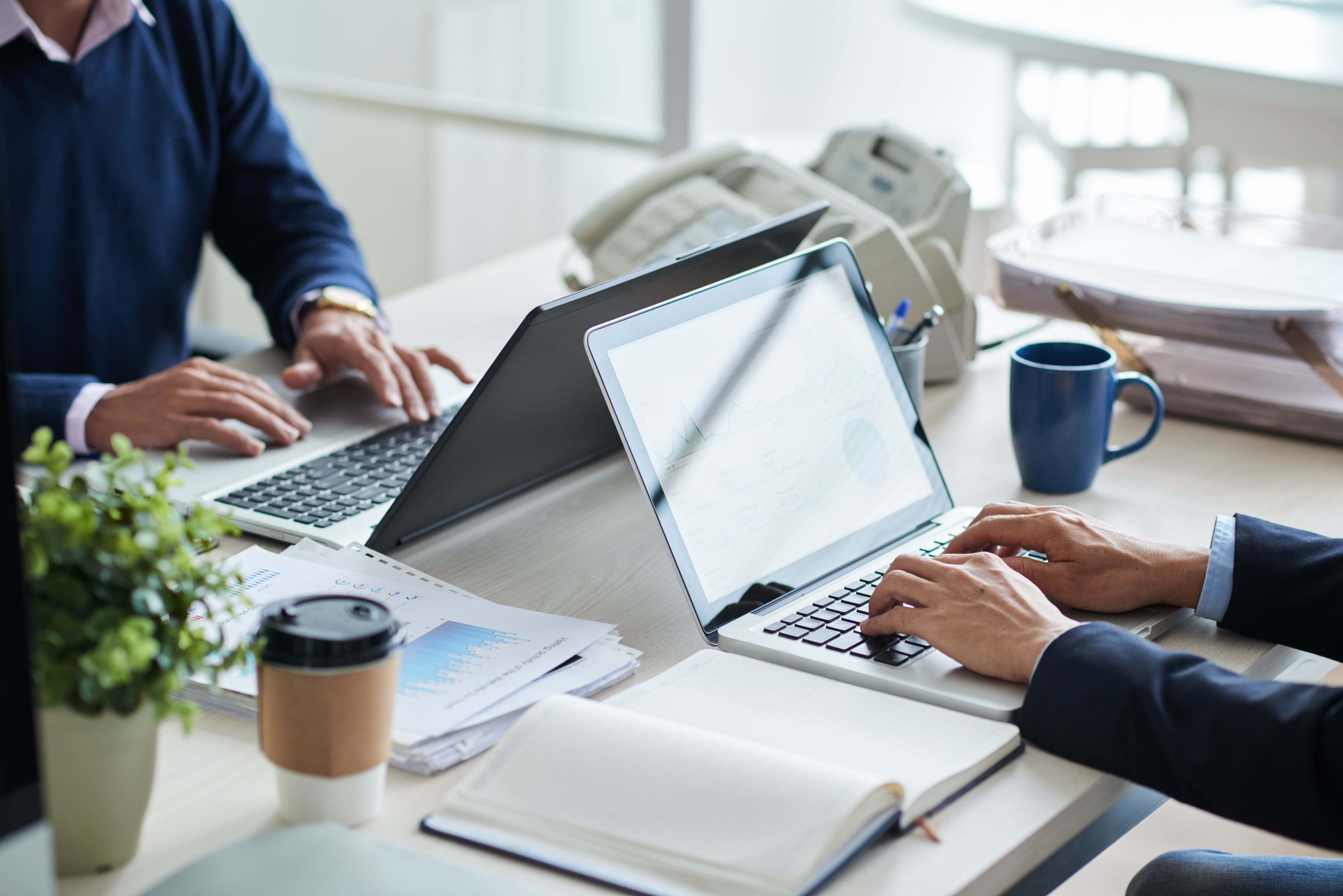 side-view-cropped-unrecognizable-business-people-working-common-desk.jpeg